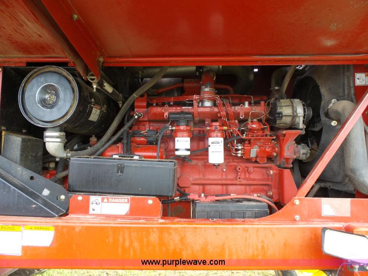 image for item J4935 2003 New Holland HW340 self-propelled windrower