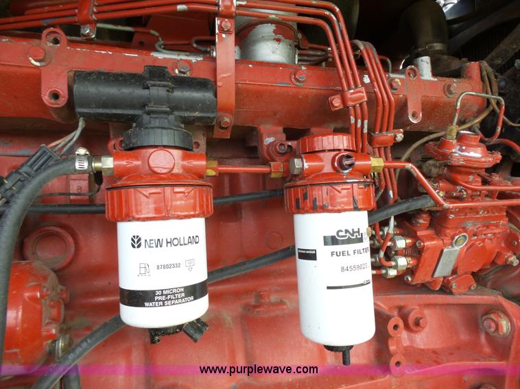 image for item J4935 2003 New Holland HW340 self-propelled windrower