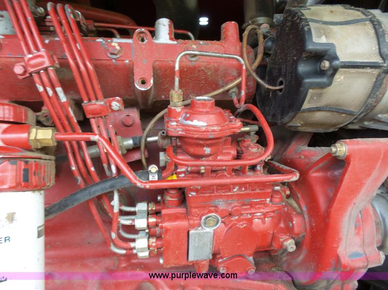 image for item J4935 2003 New Holland HW340 self-propelled windrower