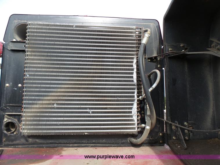 image for item J4935 2003 New Holland HW340 self-propelled windrower