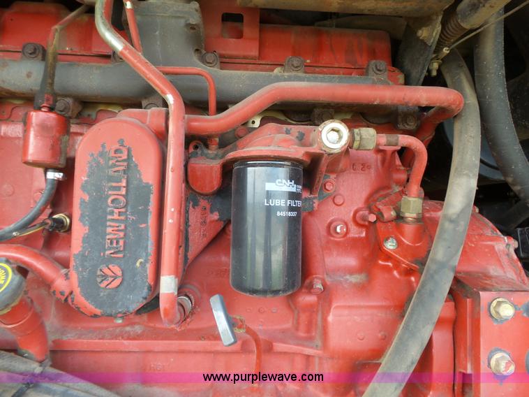 image for item J4935 2003 New Holland HW340 self-propelled windrower