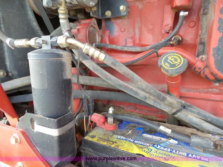 image for item J4935 2003 New Holland HW340 self-propelled windrower