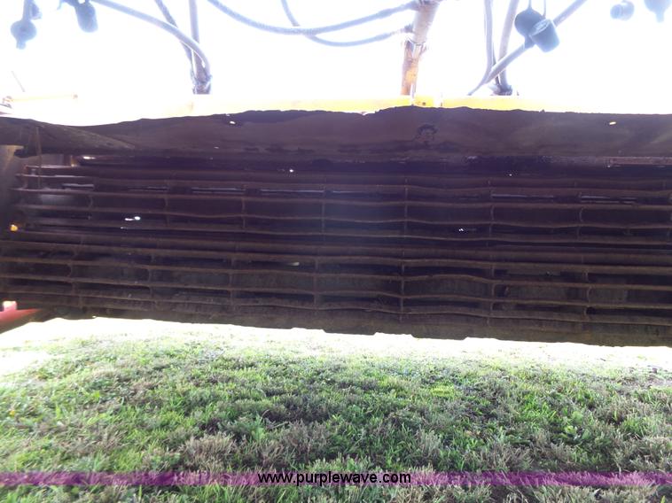 image for item J4935 2003 New Holland HW340 self-propelled windrower