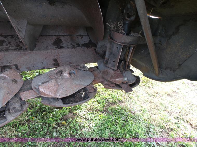 image for item J4935 2003 New Holland HW340 self-propelled windrower