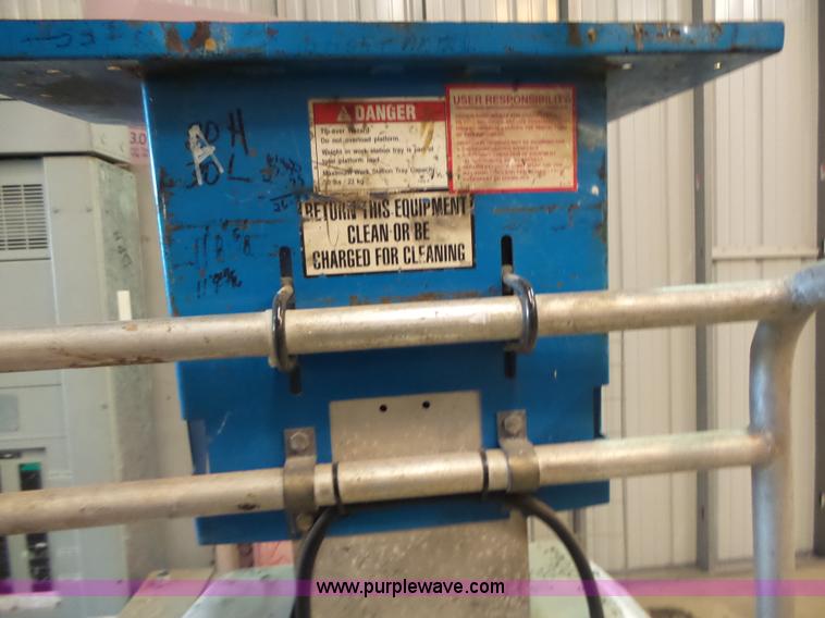 image for item L6064 2005 Genie GR15 scissor lift