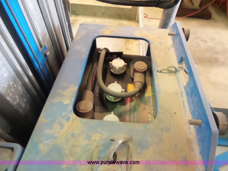 image for item L6064 2005 Genie GR15 scissor lift