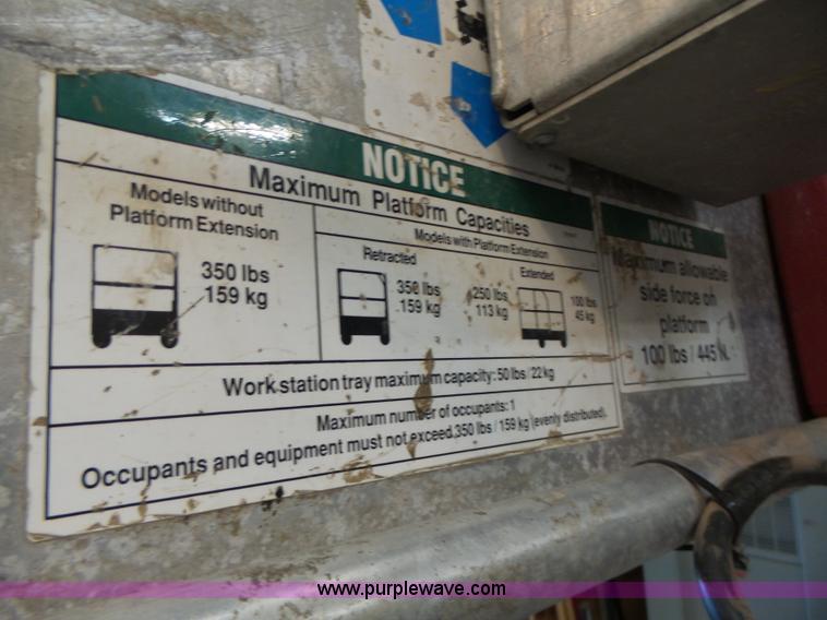 image for item L6064 2005 Genie GR15 scissor lift