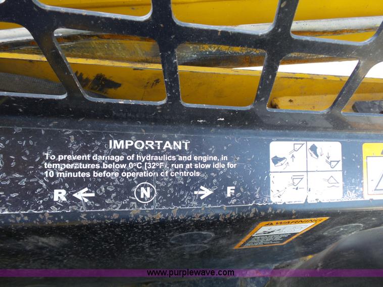 image for item J4102 John Deere 322T skid steer