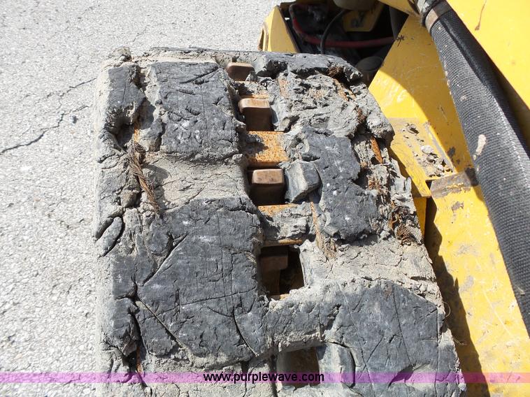 image for item J4102 John Deere 322T skid steer