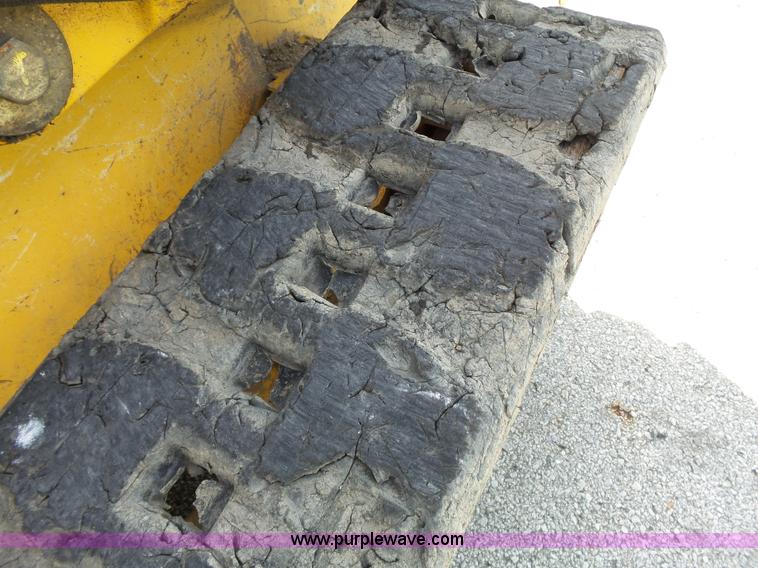 image for item J4102 John Deere 322T skid steer