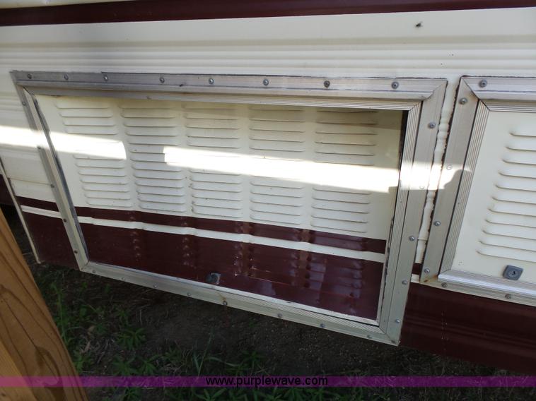 image for item J4114 1979 Dodge Brougham Coach Sportsman camper