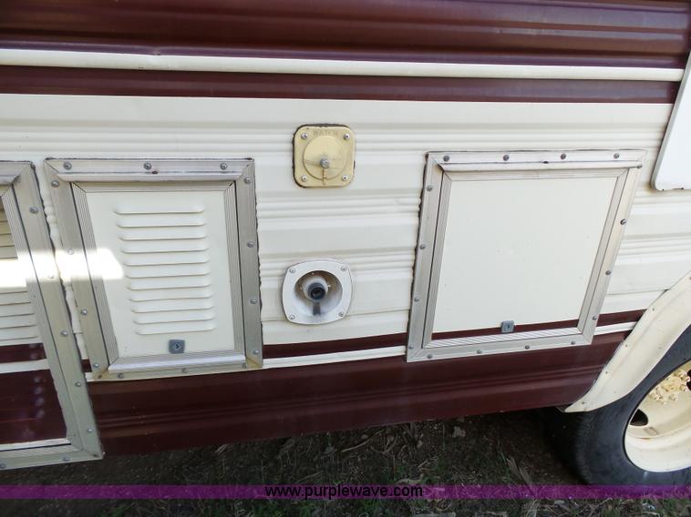 image for item J4114 1979 Dodge Brougham Coach Sportsman camper