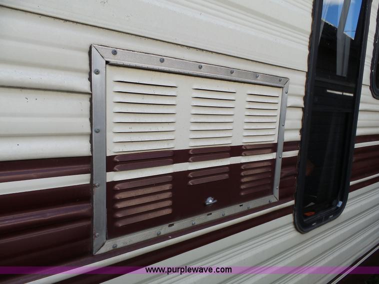 image for item J4114 1979 Dodge Brougham Coach Sportsman camper