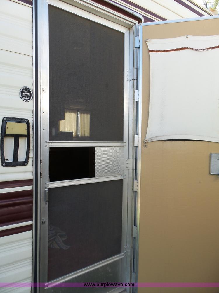 image for item J4114 1979 Dodge Brougham Coach Sportsman camper