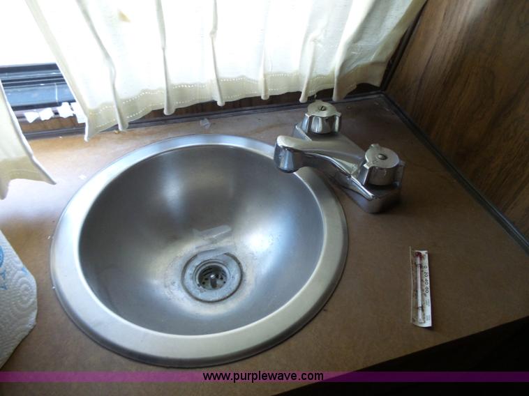 image for item J4114 1979 Dodge Brougham Coach Sportsman camper