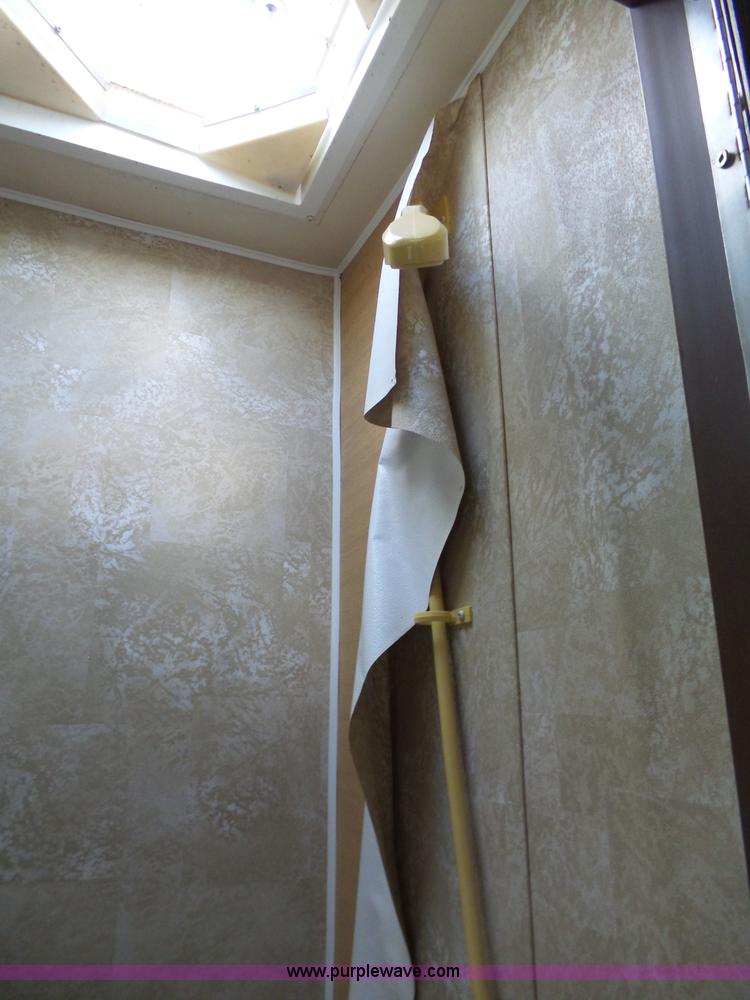 image for item J4114 1979 Dodge Brougham Coach Sportsman camper