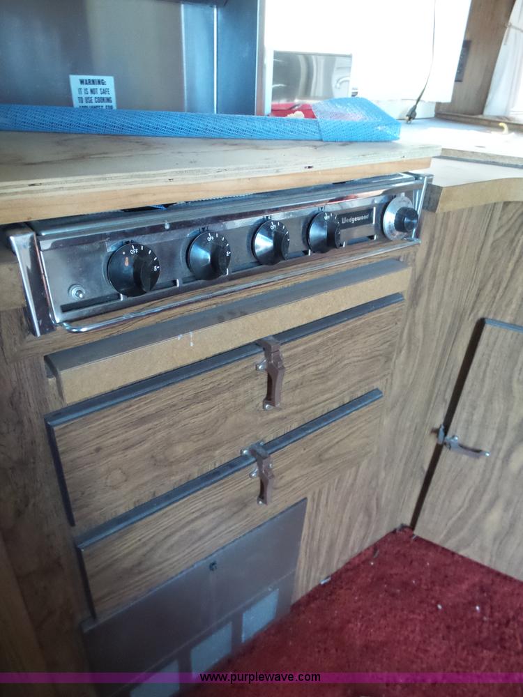 image for item J4114 1979 Dodge Brougham Coach Sportsman camper