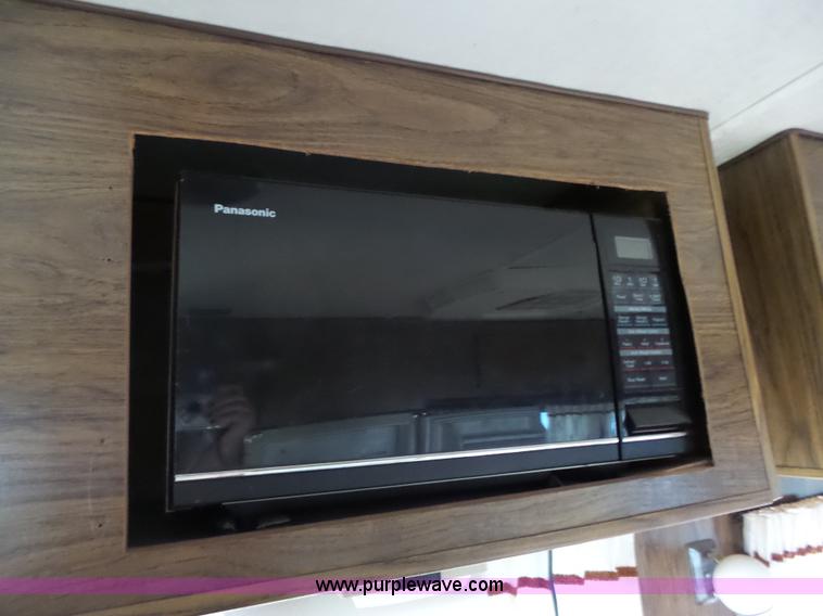 image for item J4114 1979 Dodge Brougham Coach Sportsman camper