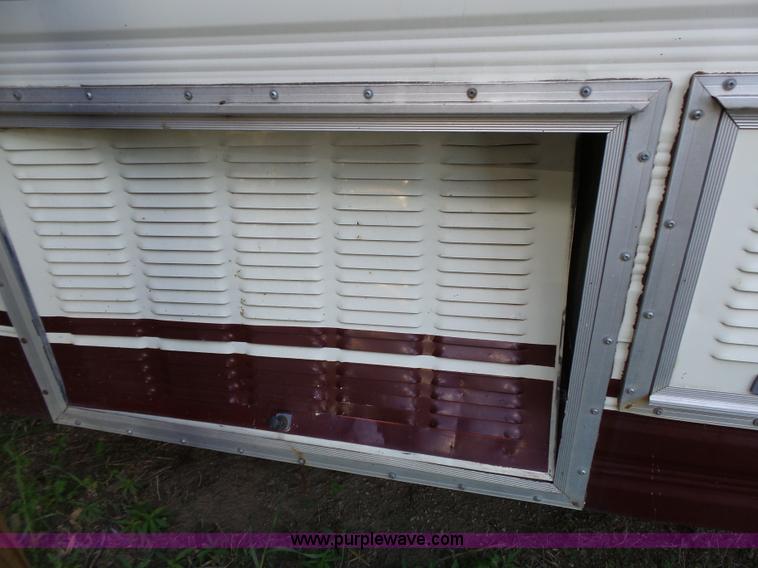 image for item J4114 1979 Dodge Brougham Coach Sportsman camper