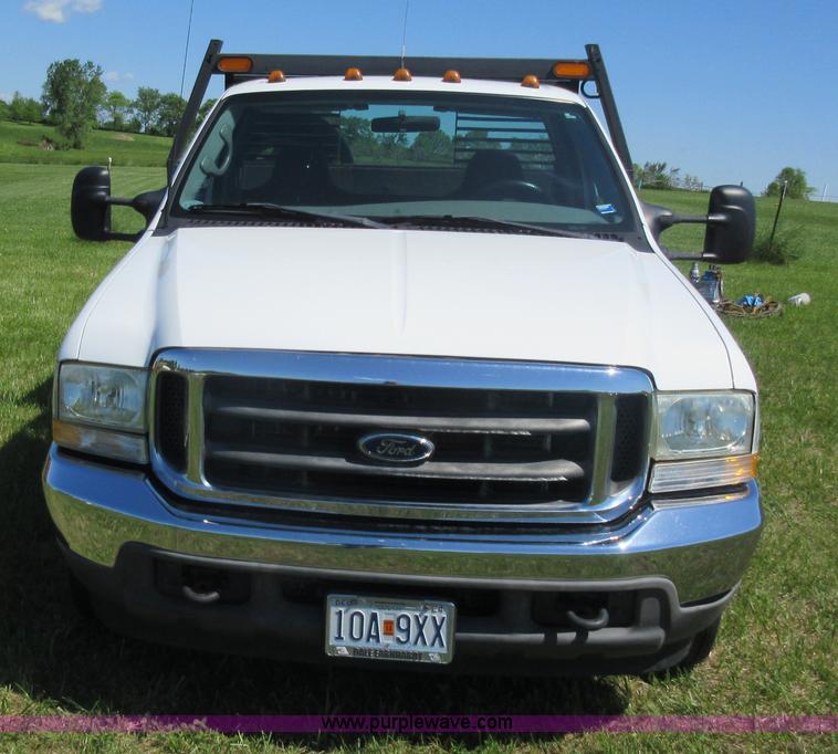 image for item K7868 2002 Ford F350 flatbed pickup truck