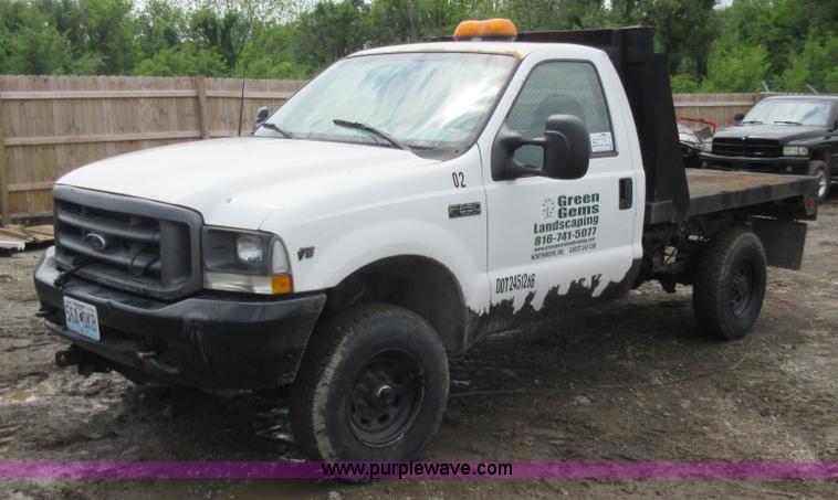 image for item K7869 2002 Ford F250 Super Duty flatbed pickup truck