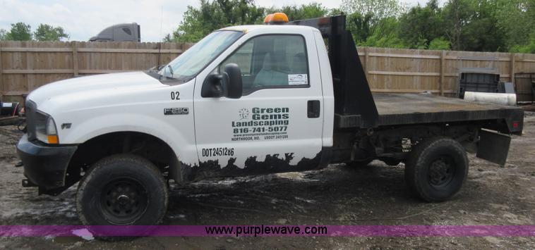 image for item K7869 2002 Ford F250 Super Duty flatbed pickup truck
