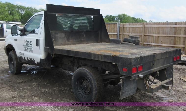 image for item K7869 2002 Ford F250 Super Duty flatbed pickup truck
