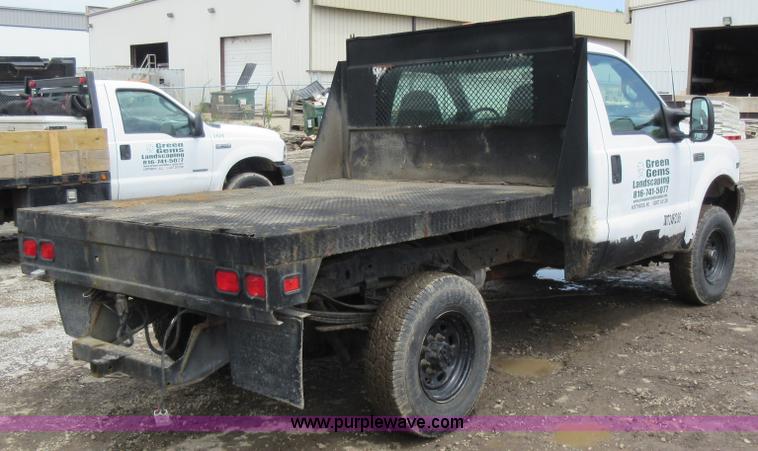 image for item K7869 2002 Ford F250 Super Duty flatbed pickup truck