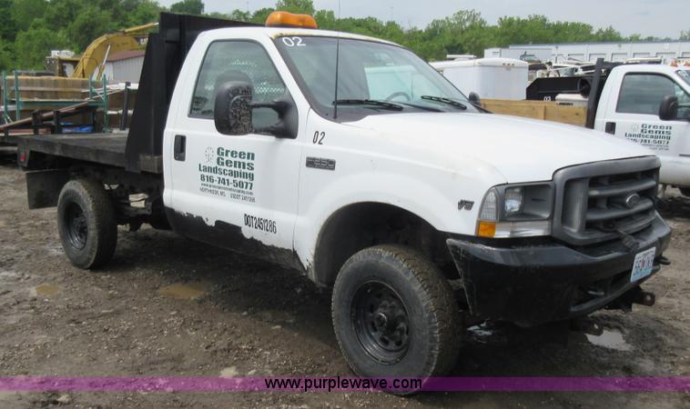 image for item K7869 2002 Ford F250 Super Duty flatbed pickup truck