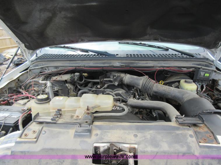 image for item K7869 2002 Ford F250 Super Duty flatbed pickup truck