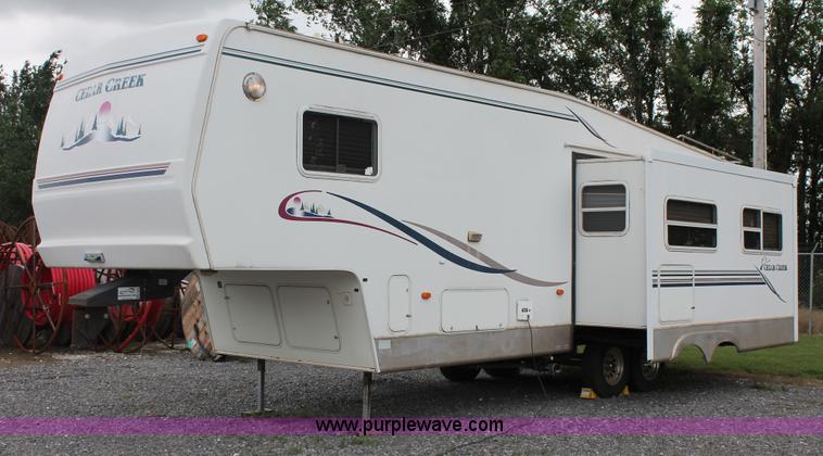 image for item K8852 2000 Cedar Creek camper