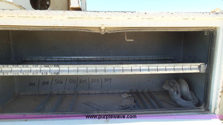 image for item L6557 1999 International 4800 digger derrick truck