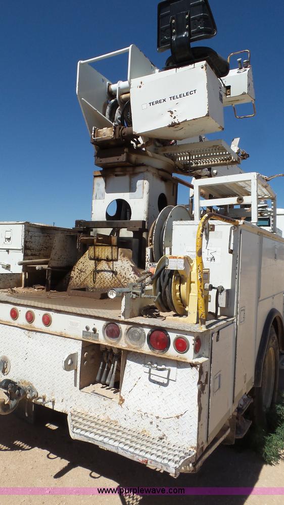 image for item L6557 1999 International 4800 digger derrick truck