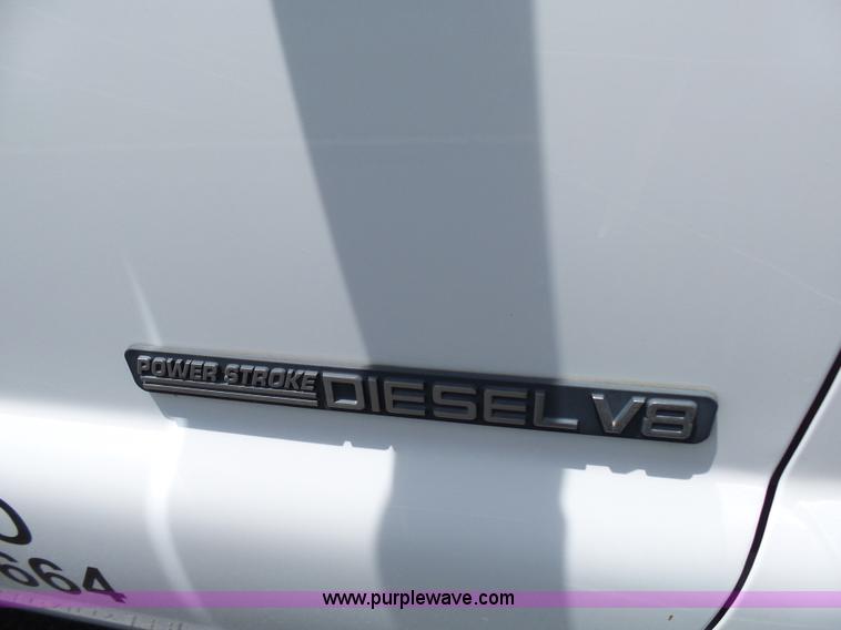 image for item L7052 2002 Ford F450 Super Duty XLT Crew Cab dump bed truck