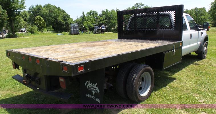image for item L7062 2008 Ford F550 Super Duty Crew Cab flatbed truck