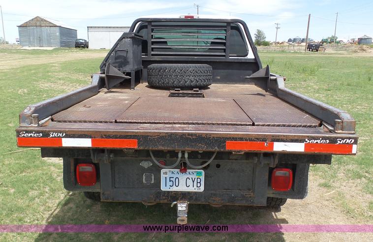 image for item AR9358 2006 Ford F350 Super Duty XL SuperCab flatbed pickup truck