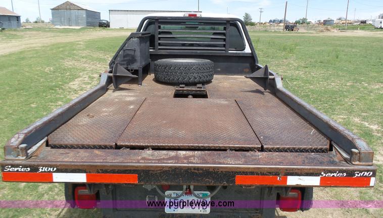 image for item AR9358 2006 Ford F350 Super Duty XL SuperCab flatbed pickup truck