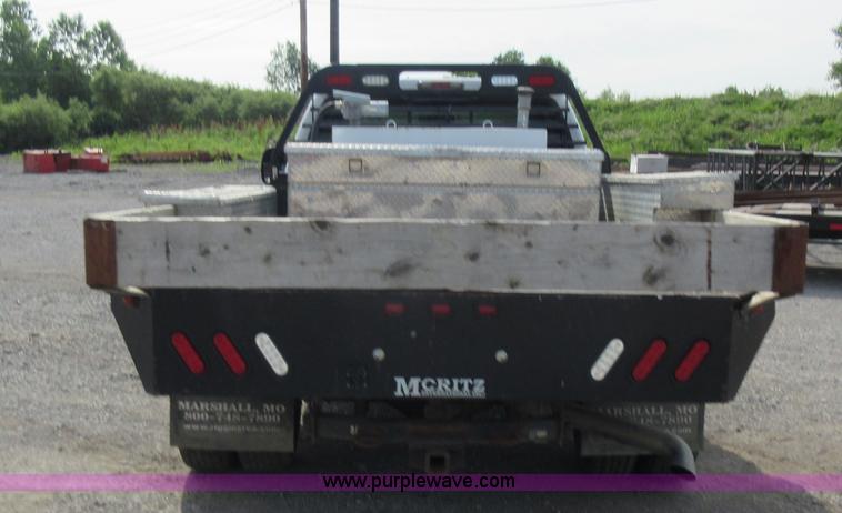 image for item L2796 1999 Ford F350 Super Duty SuperCab flatbed pickup truck