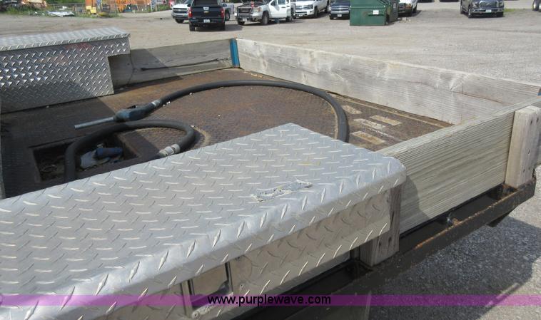 image for item L2796 1999 Ford F350 Super Duty SuperCab flatbed pickup truck