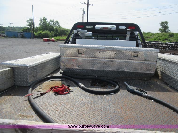 image for item L2796 1999 Ford F350 Super Duty SuperCab flatbed pickup truck