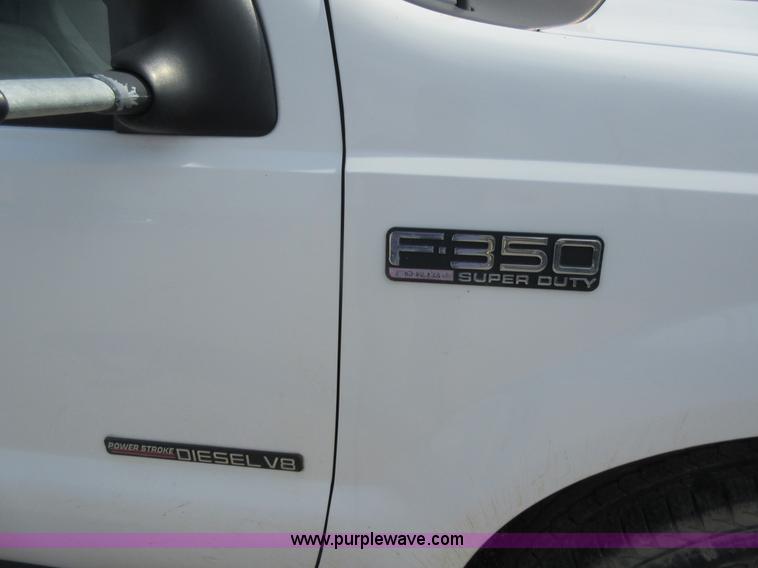 image for item L2796 1999 Ford F350 Super Duty SuperCab flatbed pickup truck