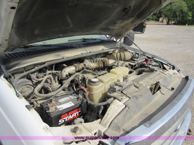 image for item L2796 1999 Ford F350 Super Duty SuperCab flatbed pickup truck