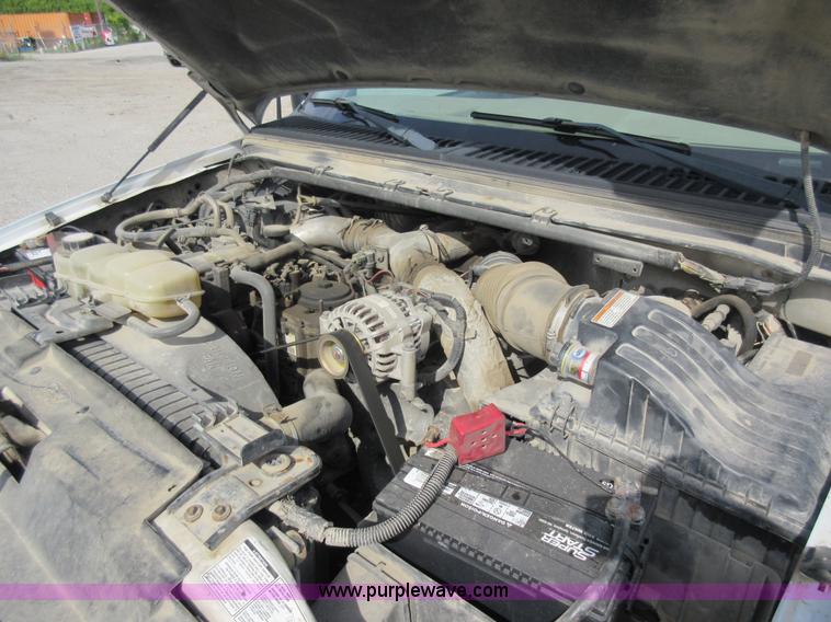 image for item L2796 1999 Ford F350 Super Duty SuperCab flatbed pickup truck