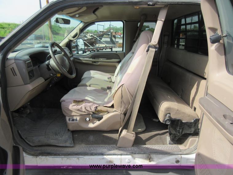 image for item L2796 1999 Ford F350 Super Duty SuperCab flatbed pickup truck