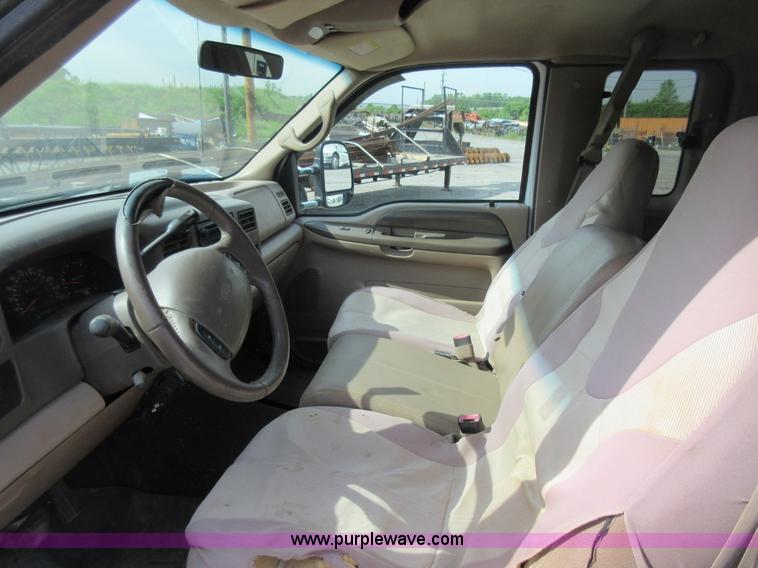 image for item L2796 1999 Ford F350 Super Duty SuperCab flatbed pickup truck