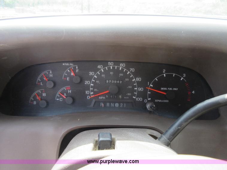 image for item L2796 1999 Ford F350 Super Duty SuperCab flatbed pickup truck