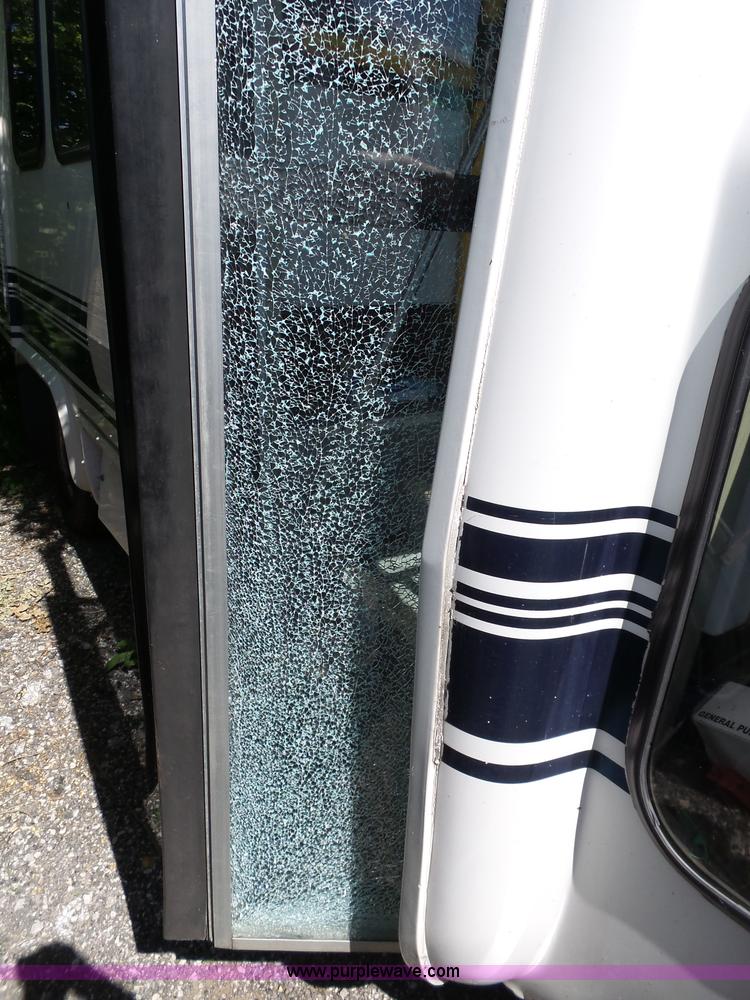 image for item J4075 2003 Ford E350 Super Duty shuttle bus