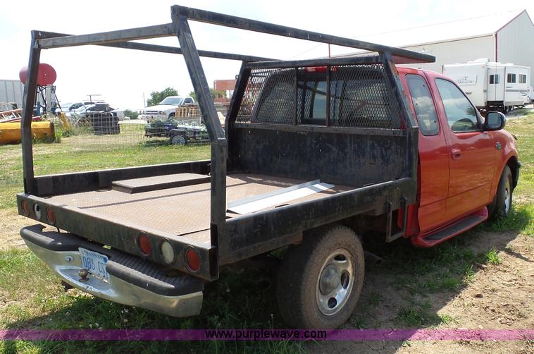 image for item J4898 1997 Ford F150 XLT flatbed pickup truck