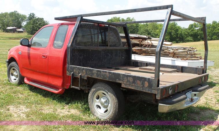 image for item J4898 1997 Ford F150 XLT flatbed pickup truck