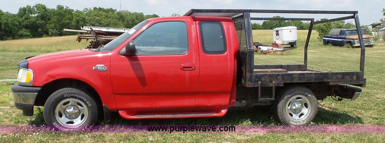 image for item J4898 1997 Ford F150 XLT flatbed pickup truck